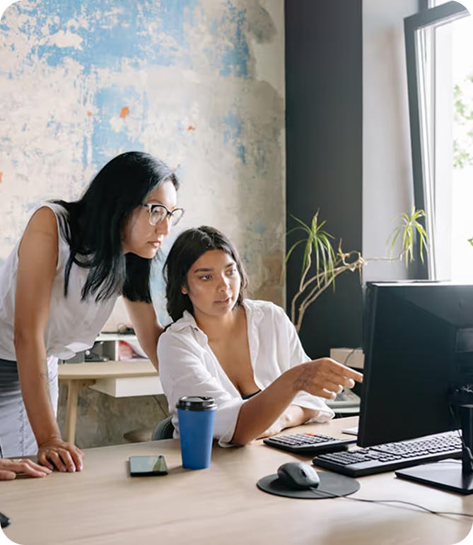 Two colleagues working at a computer