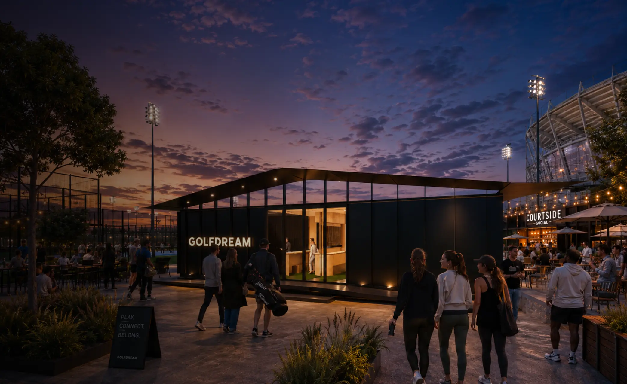 People walking and socializing at dusk outside a modern building with illuminated sign reading 'GOLFDREAM,' near an outdoor sports court and a lit venue named 'COURTSIDE SOCIAL'.