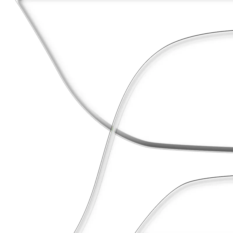 Close-up of three overlapping clear, curved glass or plastic sheets on a white background.