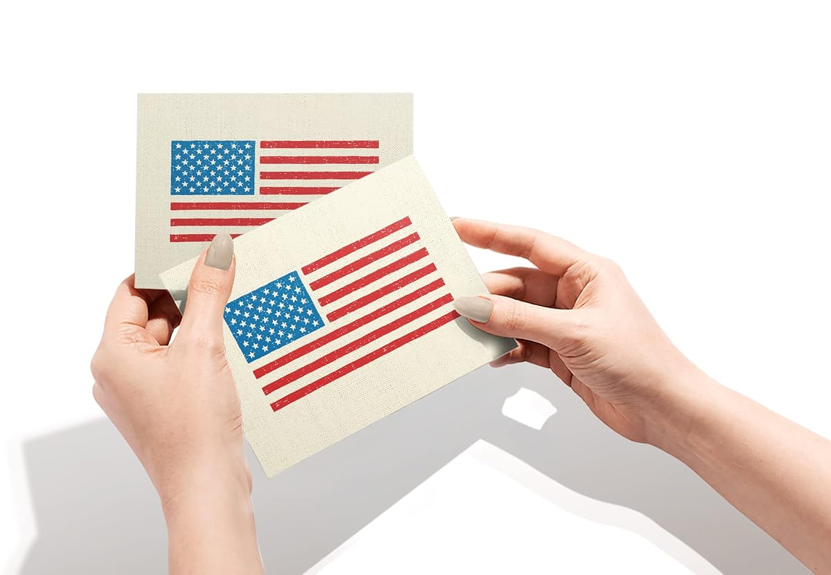 Hands holding two American flag note cards