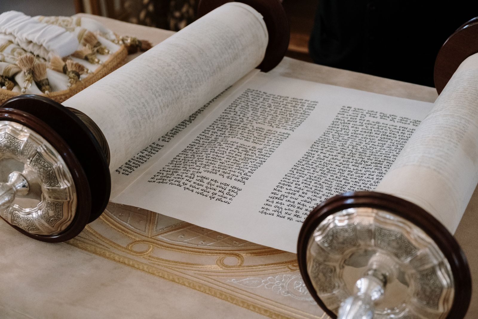 An open Torah scroll on a table