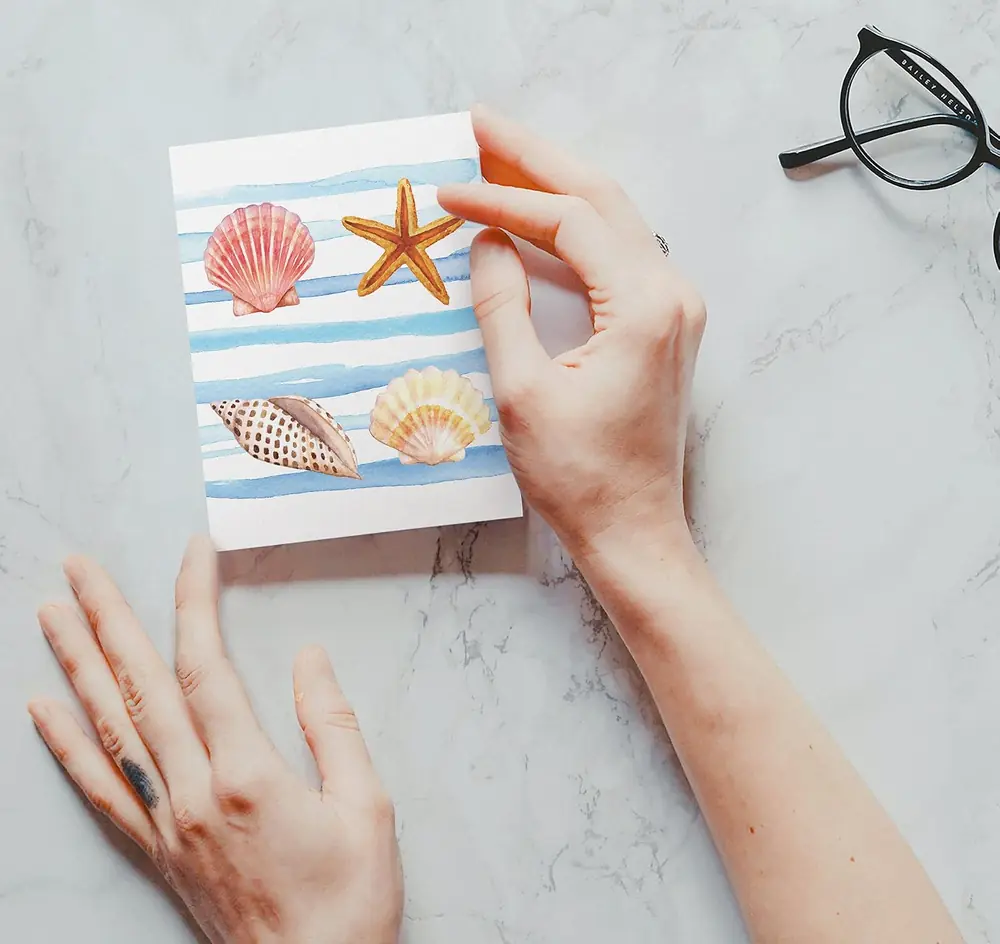 Hand writing a note in a greeting card