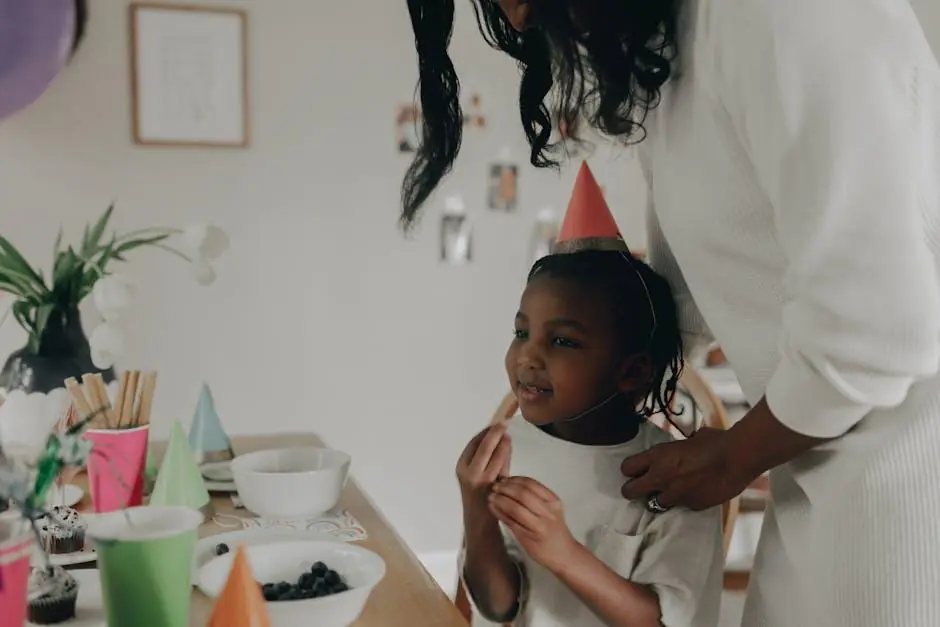 A girl in a party hat at her birthday party