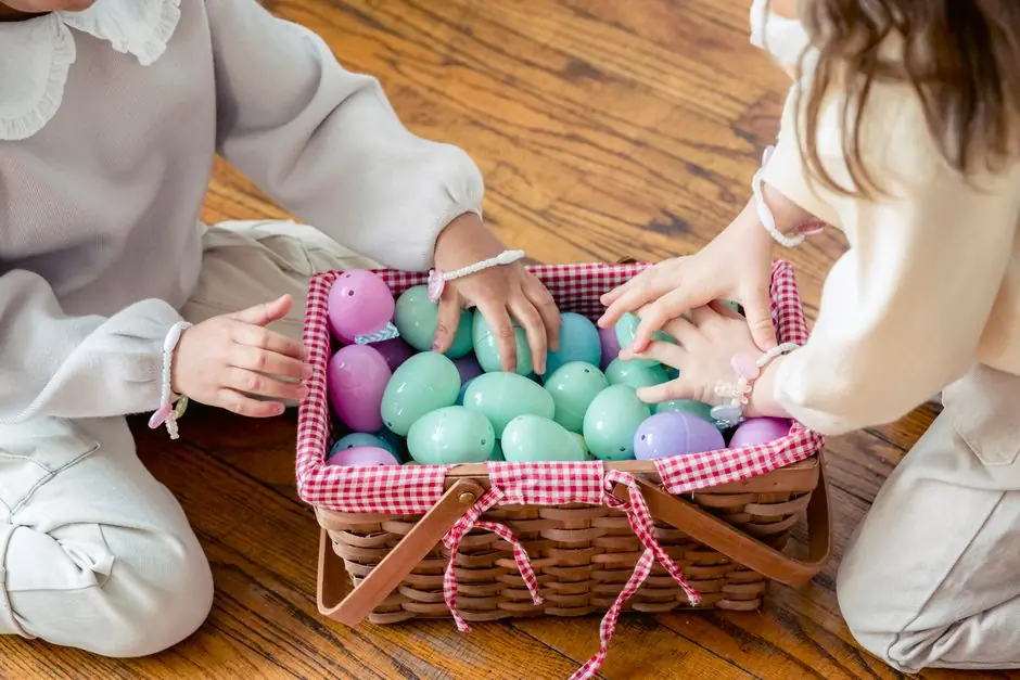 Children reaching into a basket of dyed Easter eggs