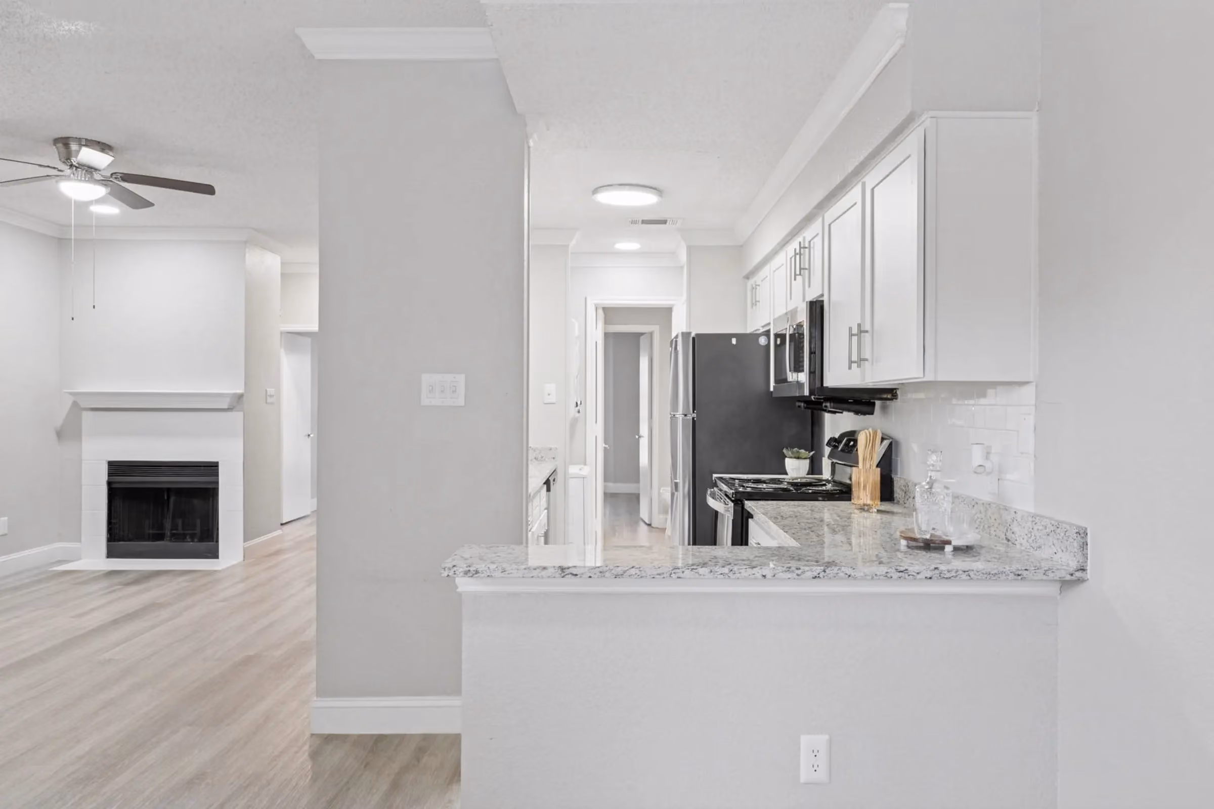 Kitchen with white cabinets at Willow Ridge Townhomes and Apartmnets in Euless, Texas
