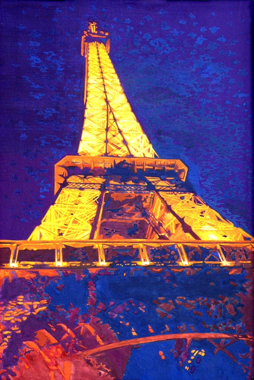 View looking up at the illuminated Eiffel Tower glowing golden against a deep blue night sky.