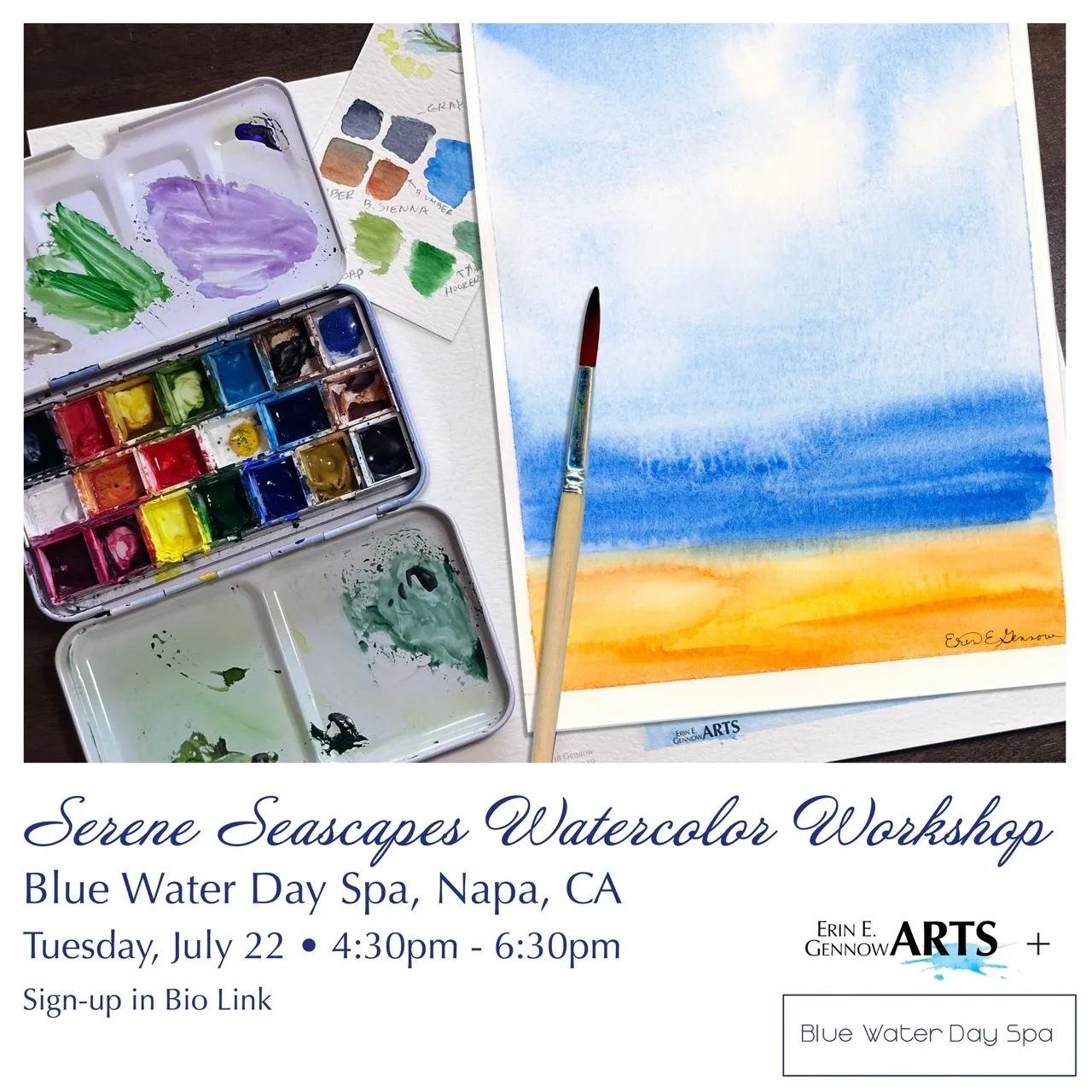 A soft watercolor seascape in blue and gold beside a travel paint palette.