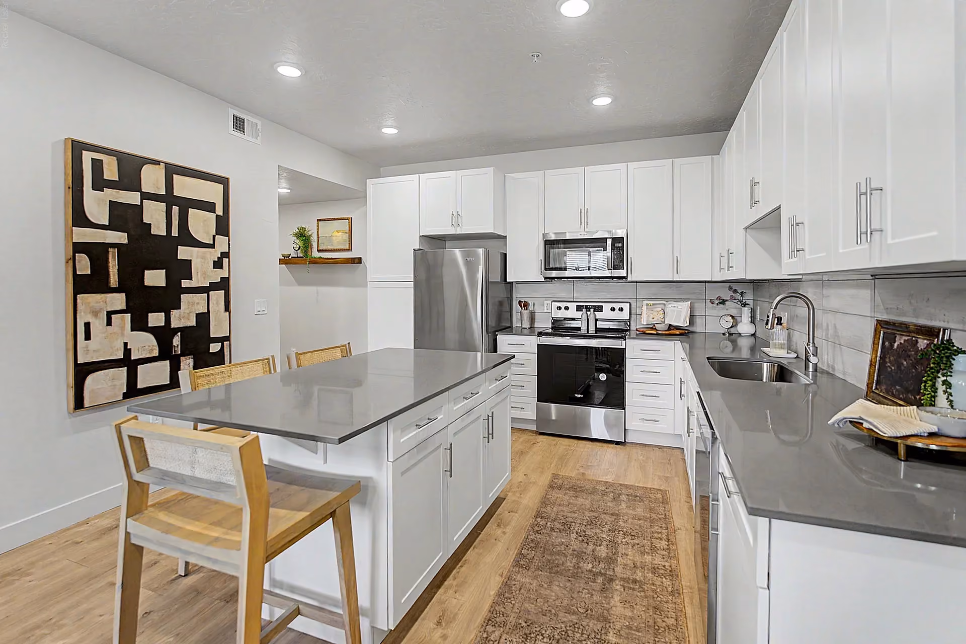 Kitchen with island and white cabinets