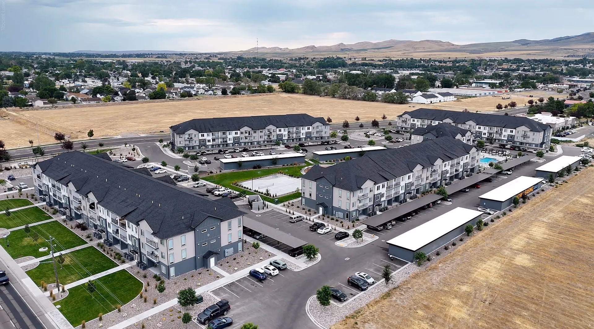 Aerial view of Via Apartments and surrounding neighborhood, field view