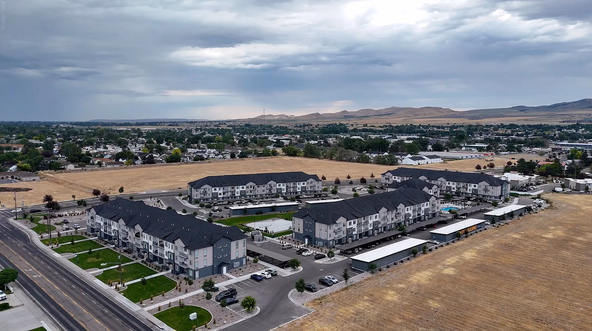 Aerial view of Via Apartments and surrounding neighborhood, field view