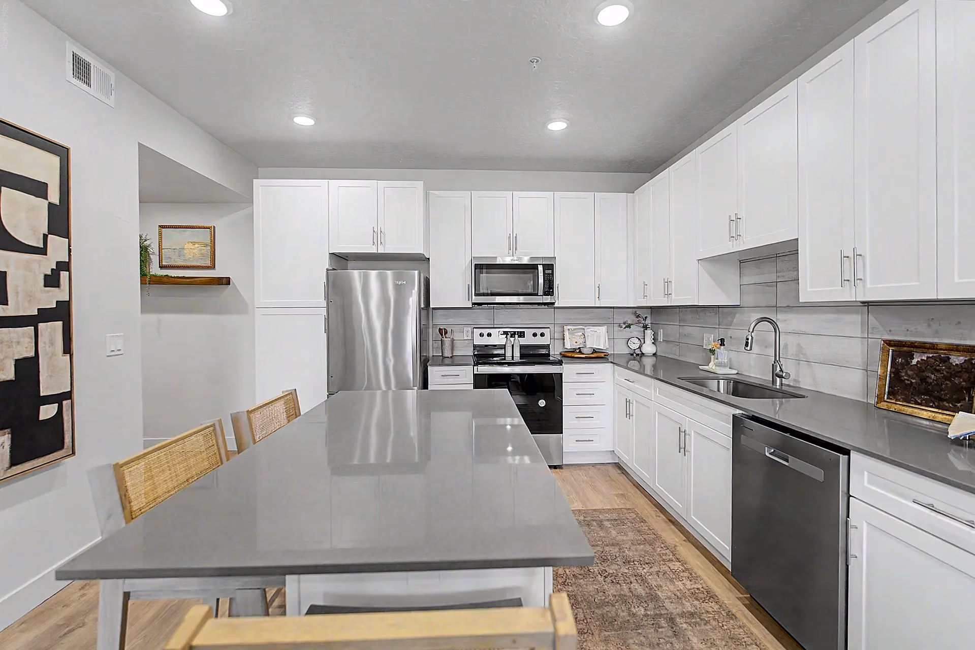 Kitchen with island and white cabinets