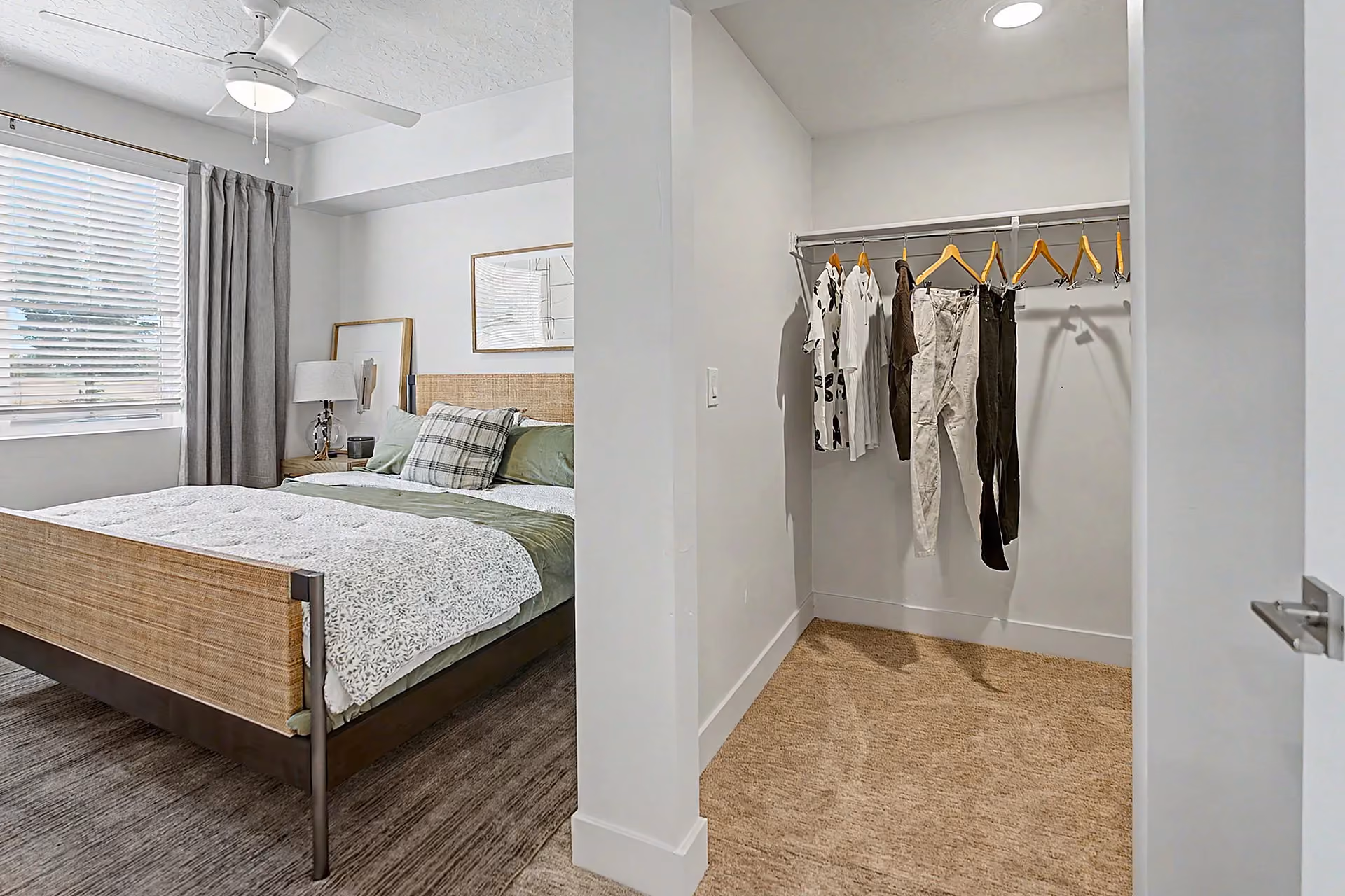Furnished bedroom with view of walk in closet