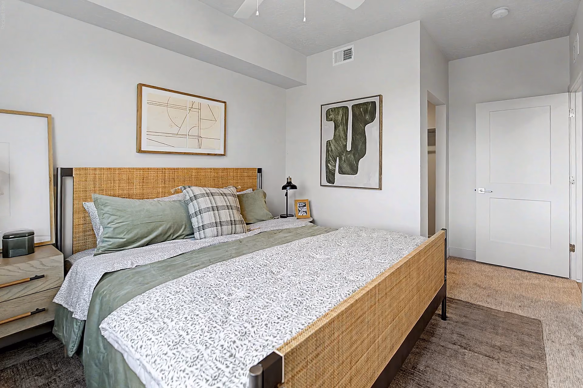 Furnished bedroom with view of entry and walk in closet