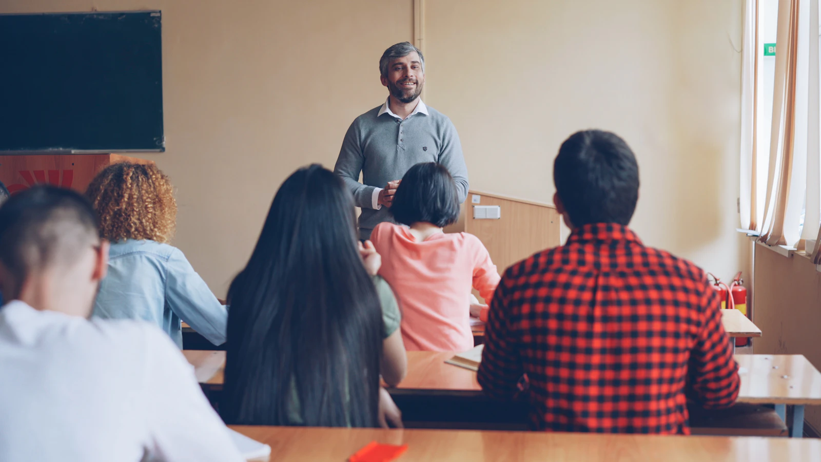 Instructor teaching a class of adult students