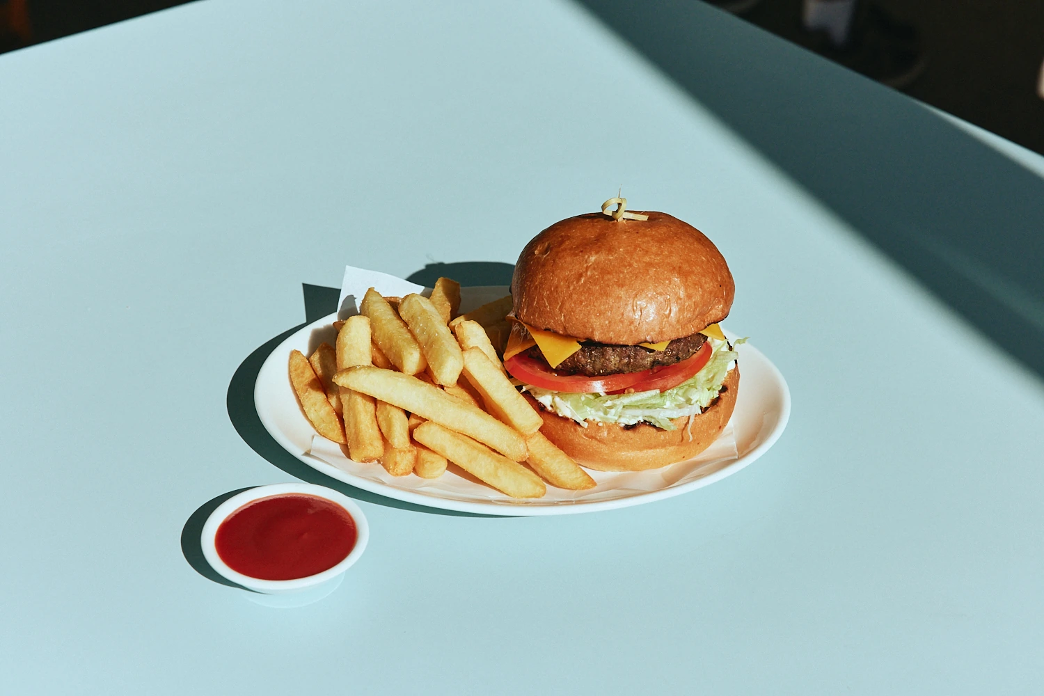 Cheeseburger with fries and tomato sauce at The Pav