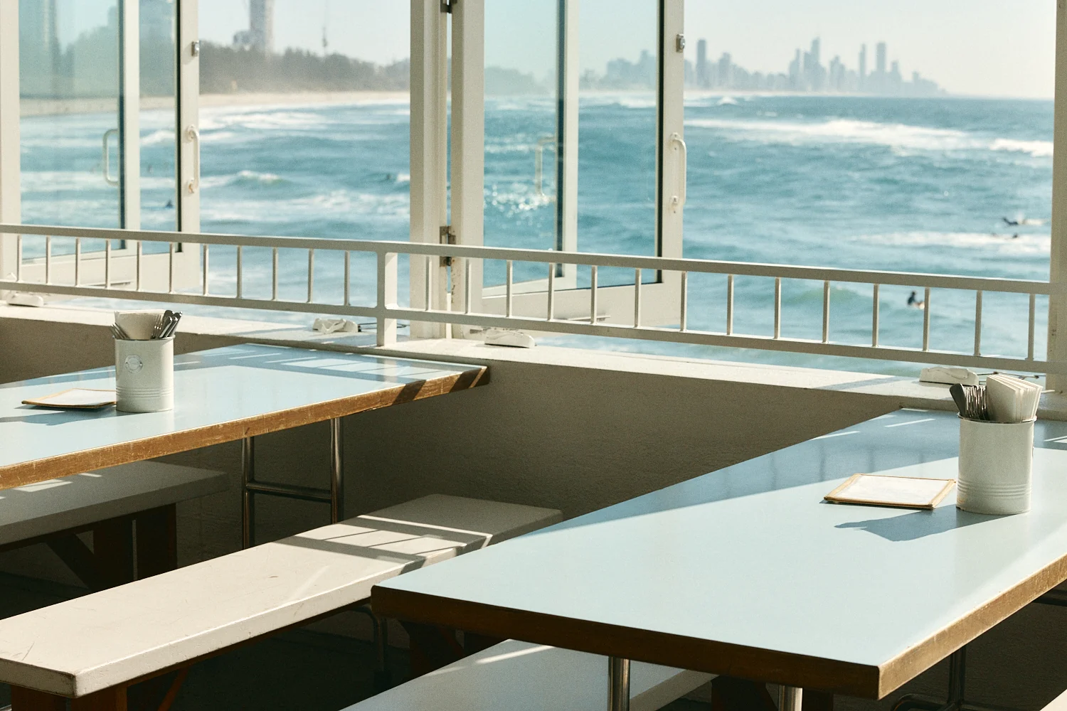 Window tables looking across the water to the Surfers Paradise skyline
