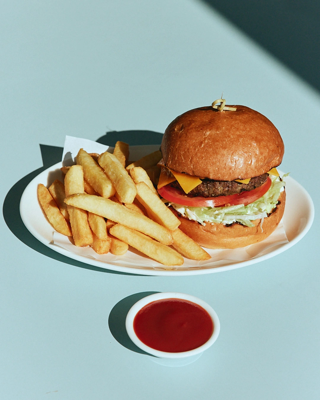 Cheeseburger with fries and tomato sauce at The Pav