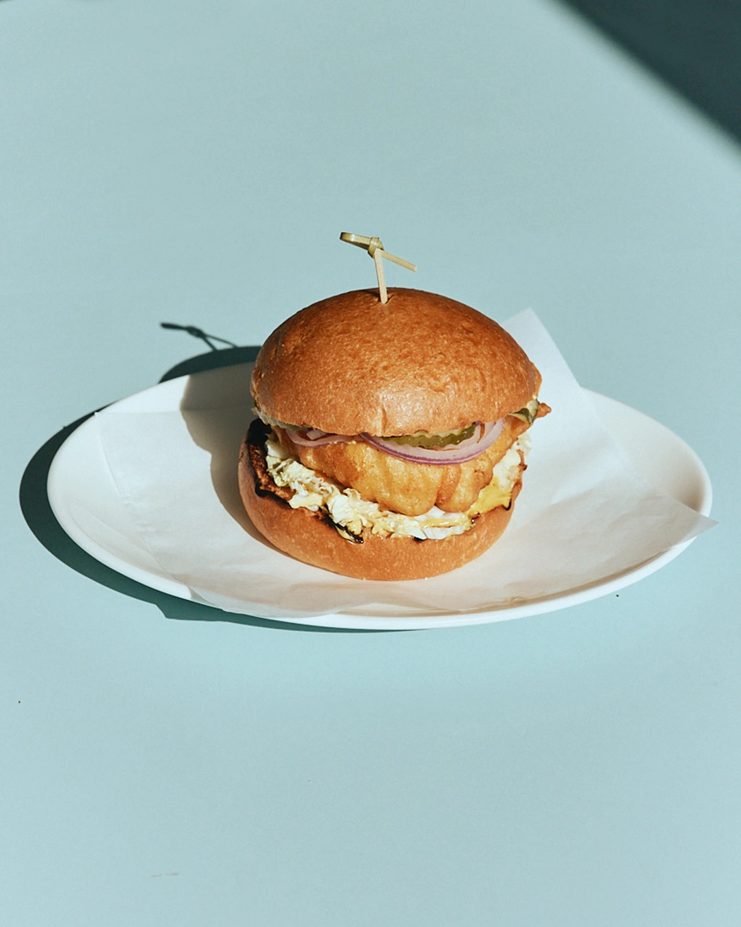Crispy chicken burger with slaw and fries at The Pav