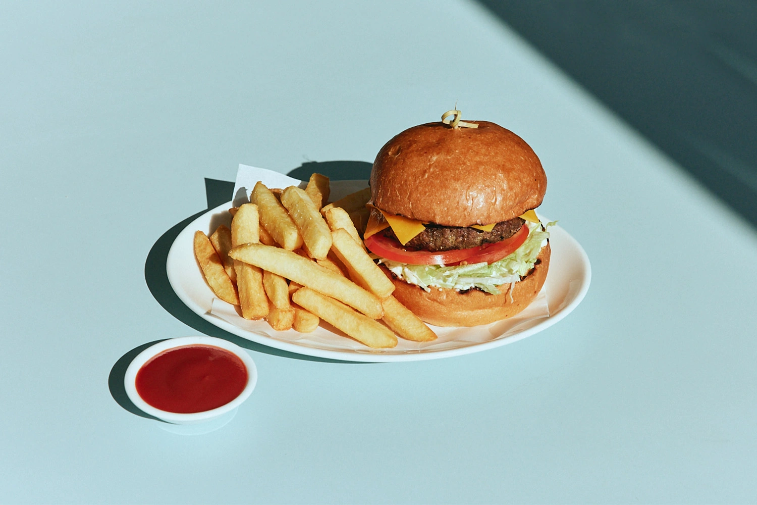 Cheeseburger with fries and tomato sauce at The Pav