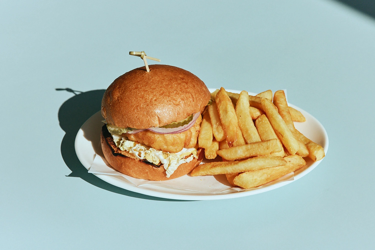 Crispy chicken burger with slaw and fries at The Pav