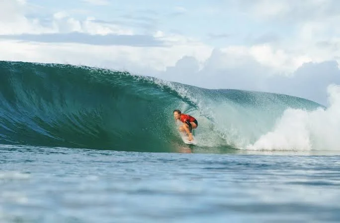Surfer riding inside a barrelling wave at Burleigh Heads
