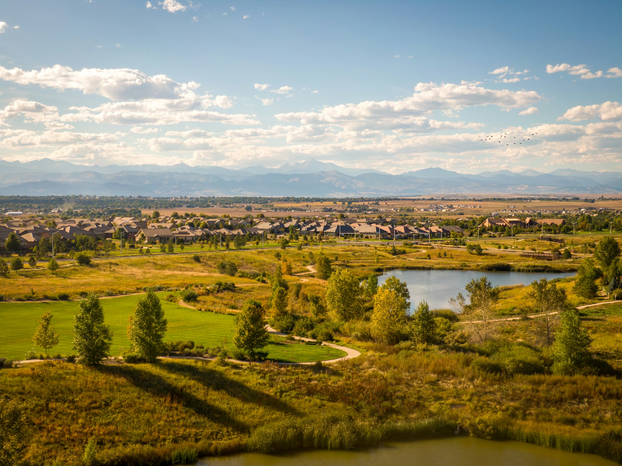 A Colorado golf course with the Rocky Mountains beyond