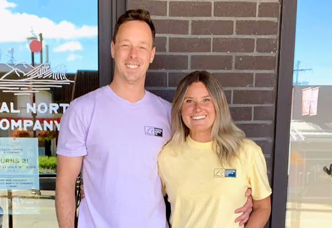 A photo of Drew and Ash, co owners of a clothing store