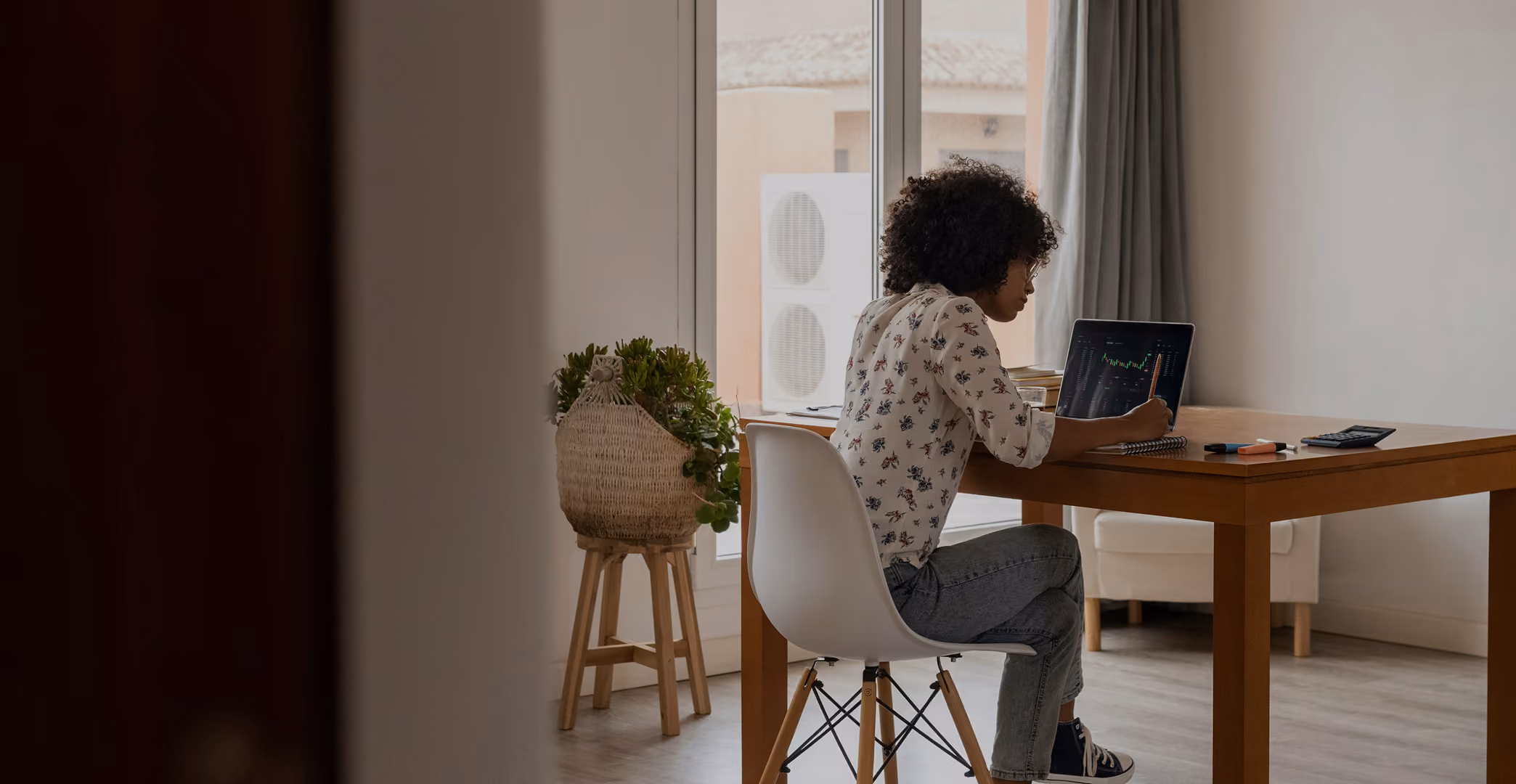 a woman works at a computer