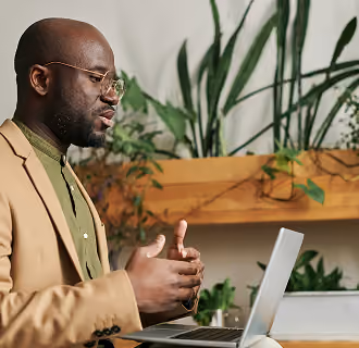 a man speaks to a video meeting