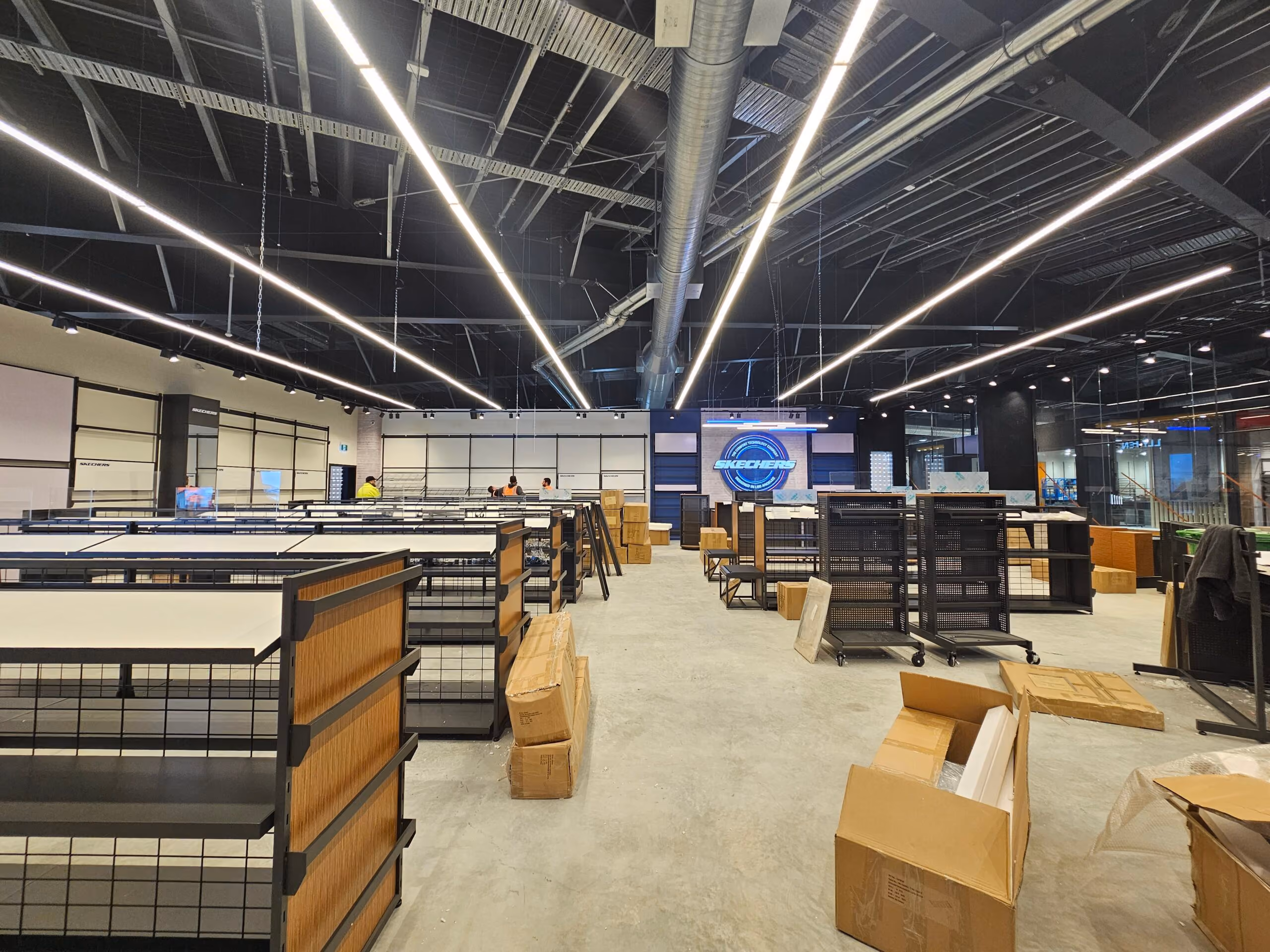 Skechers Manawa Bay fit-out with long linear LED lighting above new shelving