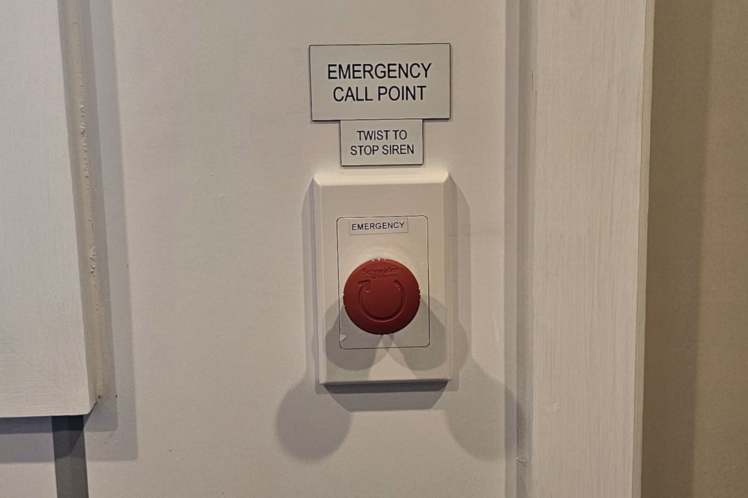 Emergency call point installed on a wall at Milford Primary School