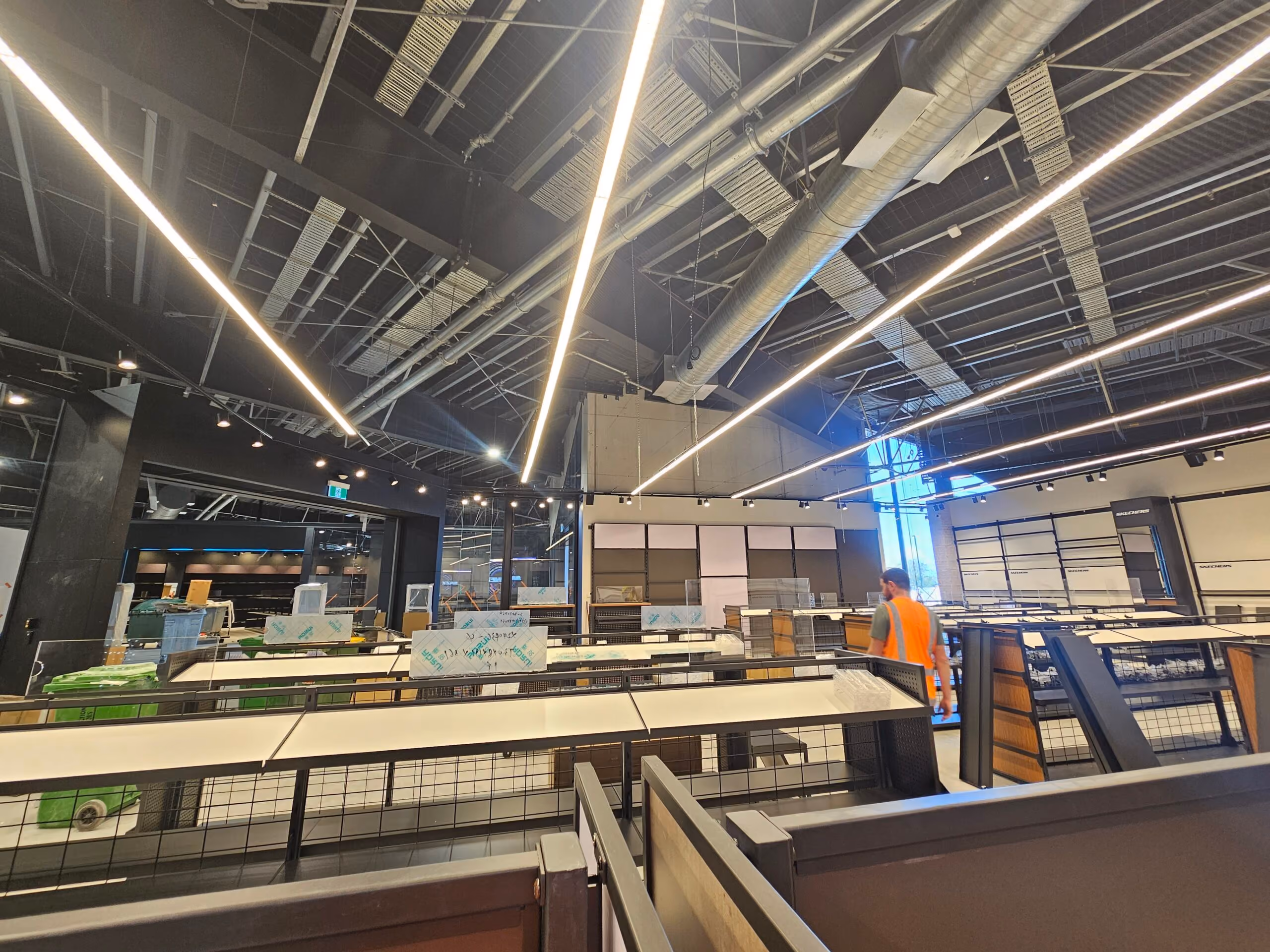 Skechers Manawa Bay store interior with linear LED lighting during fit-out