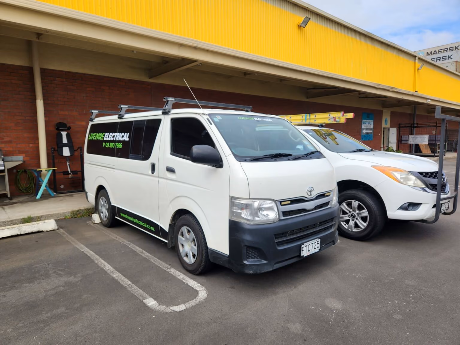 White Livewire Electrical van parked outside a workshop