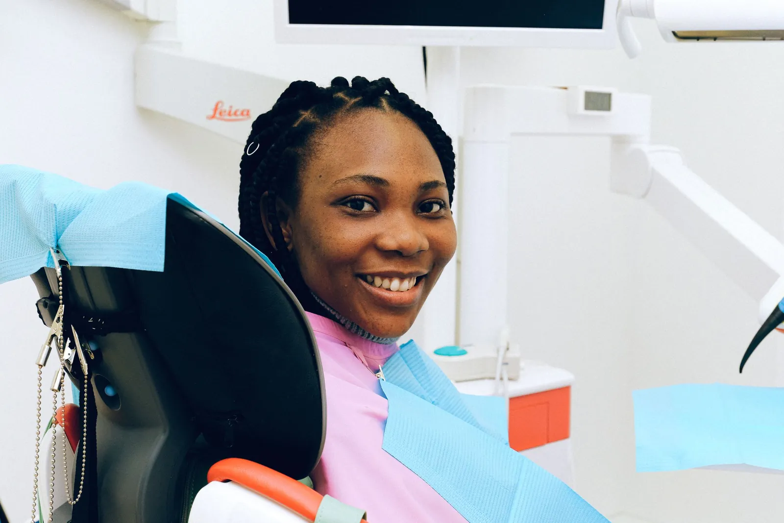 Smiling patient in a dental chair
