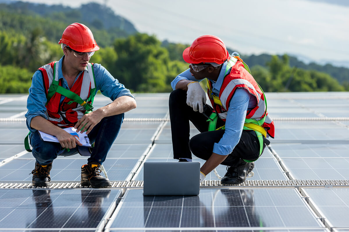 Technicians installing solar panels