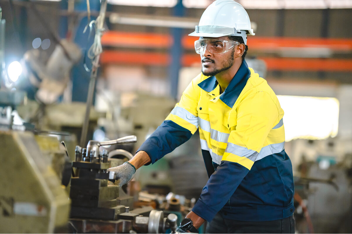 Factory machine operator at work