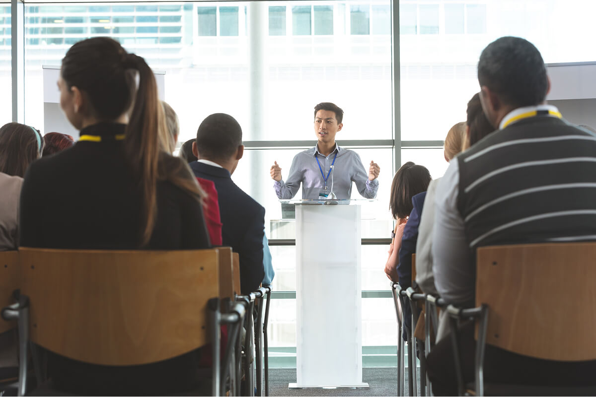 Speaker presenting at a conference