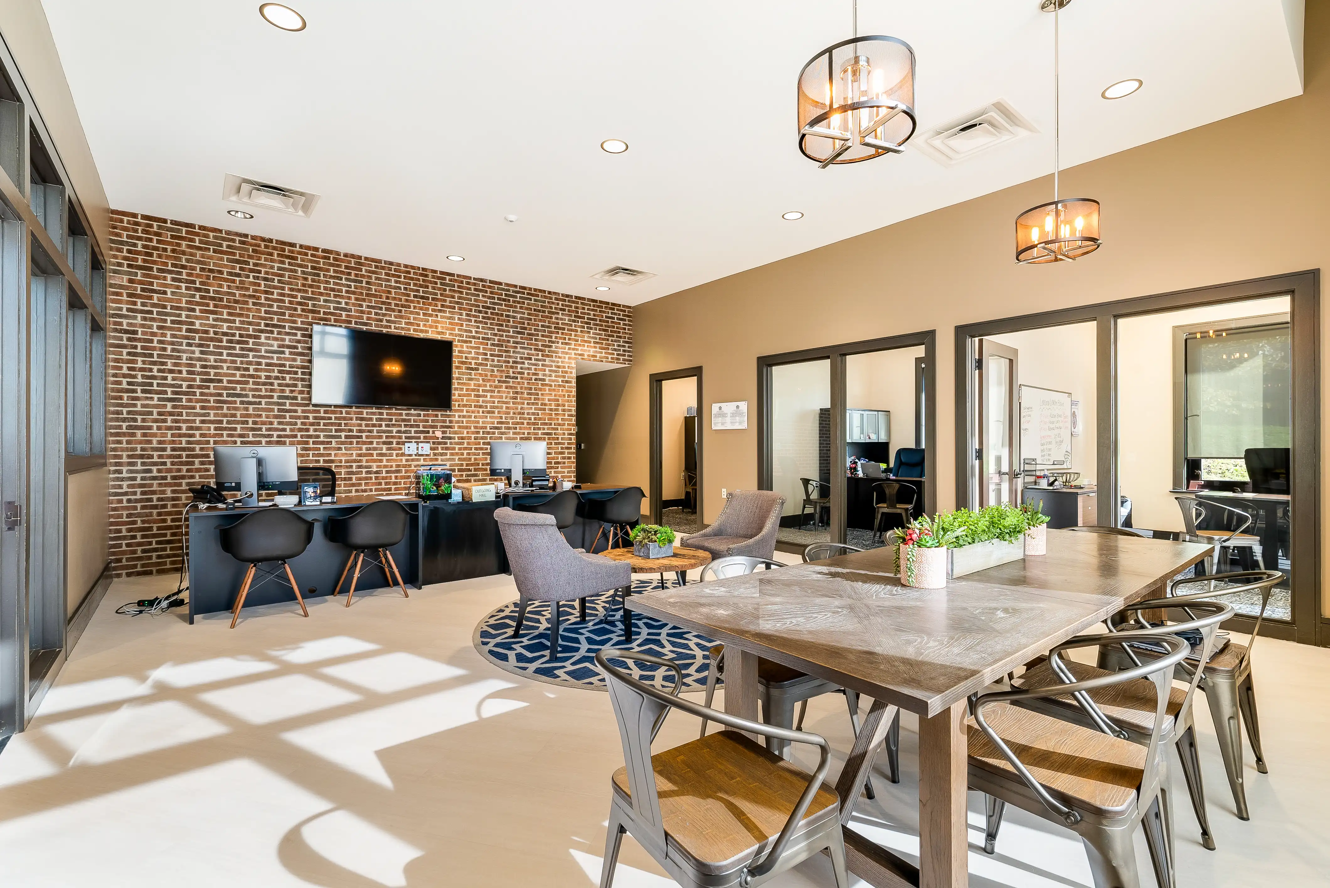 Clubhouse lounge with a brick accent wall