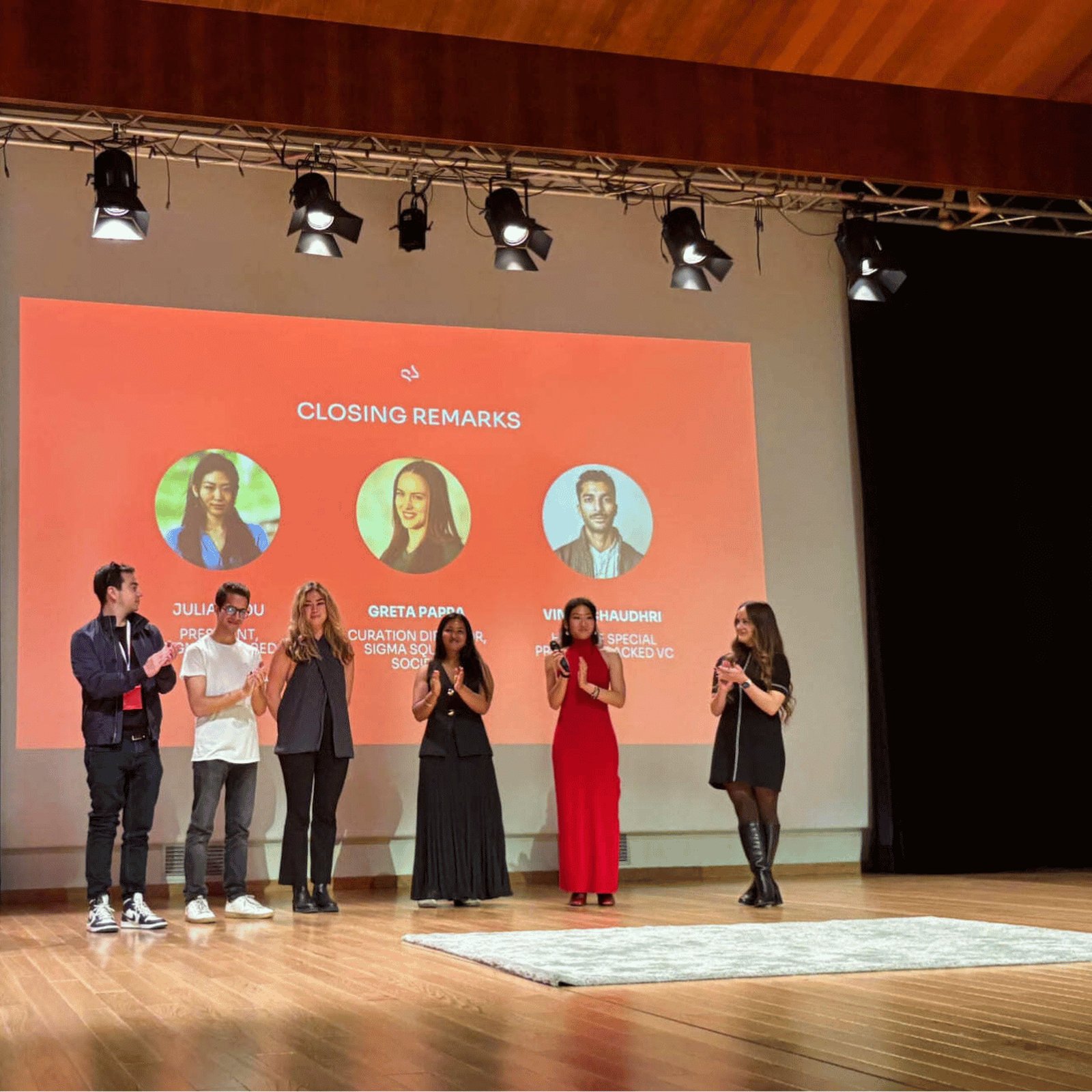 Closing remarks on stage at the Sigma Squared Summit 2025 in the Palau de la Música, Valencia