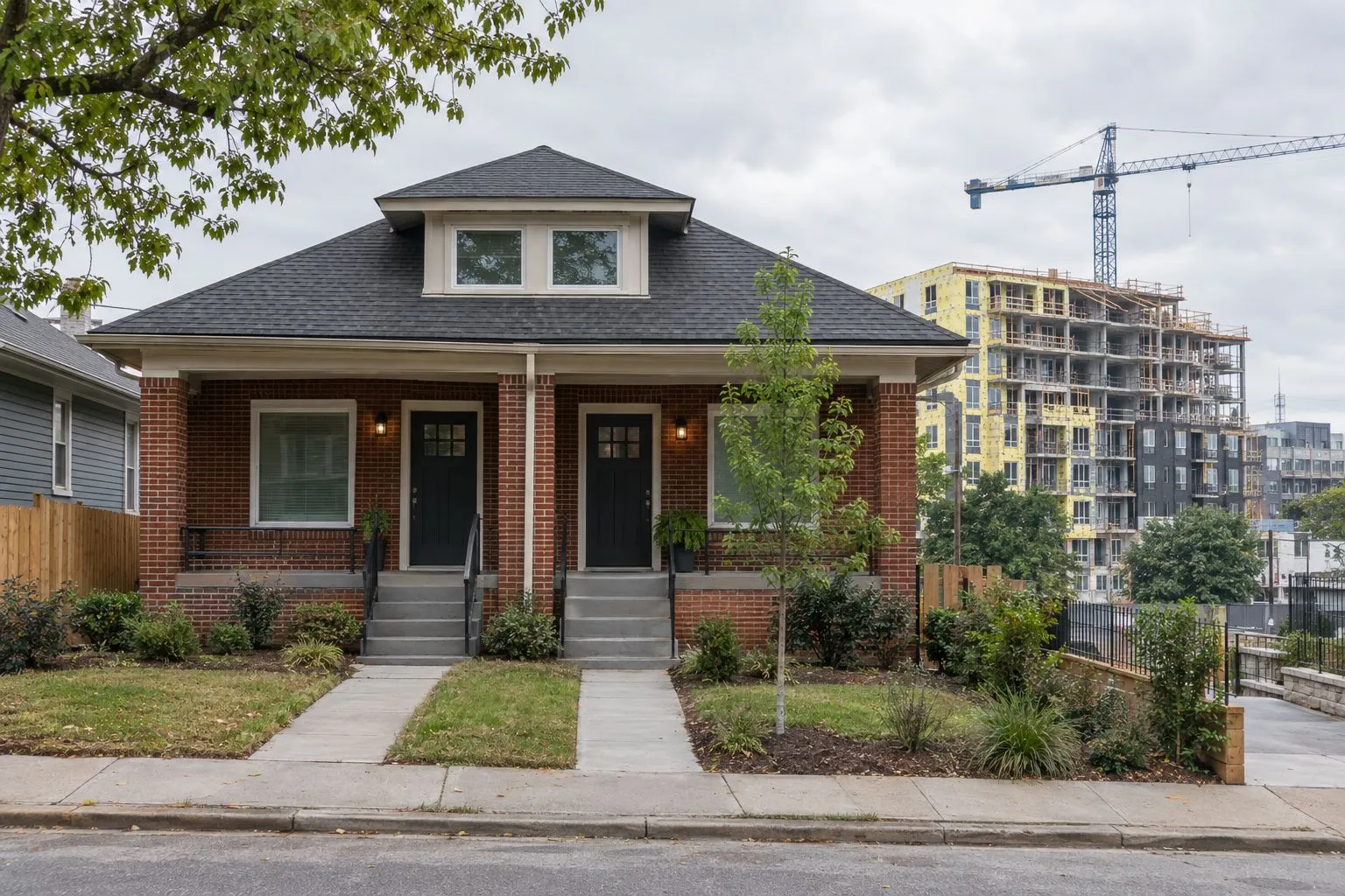 A brick duplex with two front doors