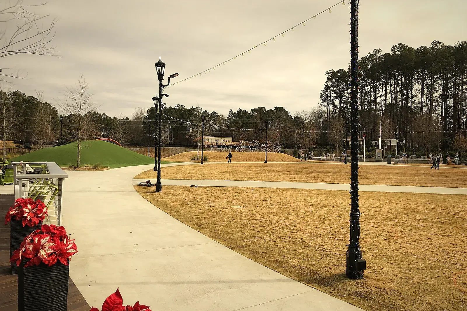 Walking path, lamp posts and open lawn at Peachtree Corners Town Center