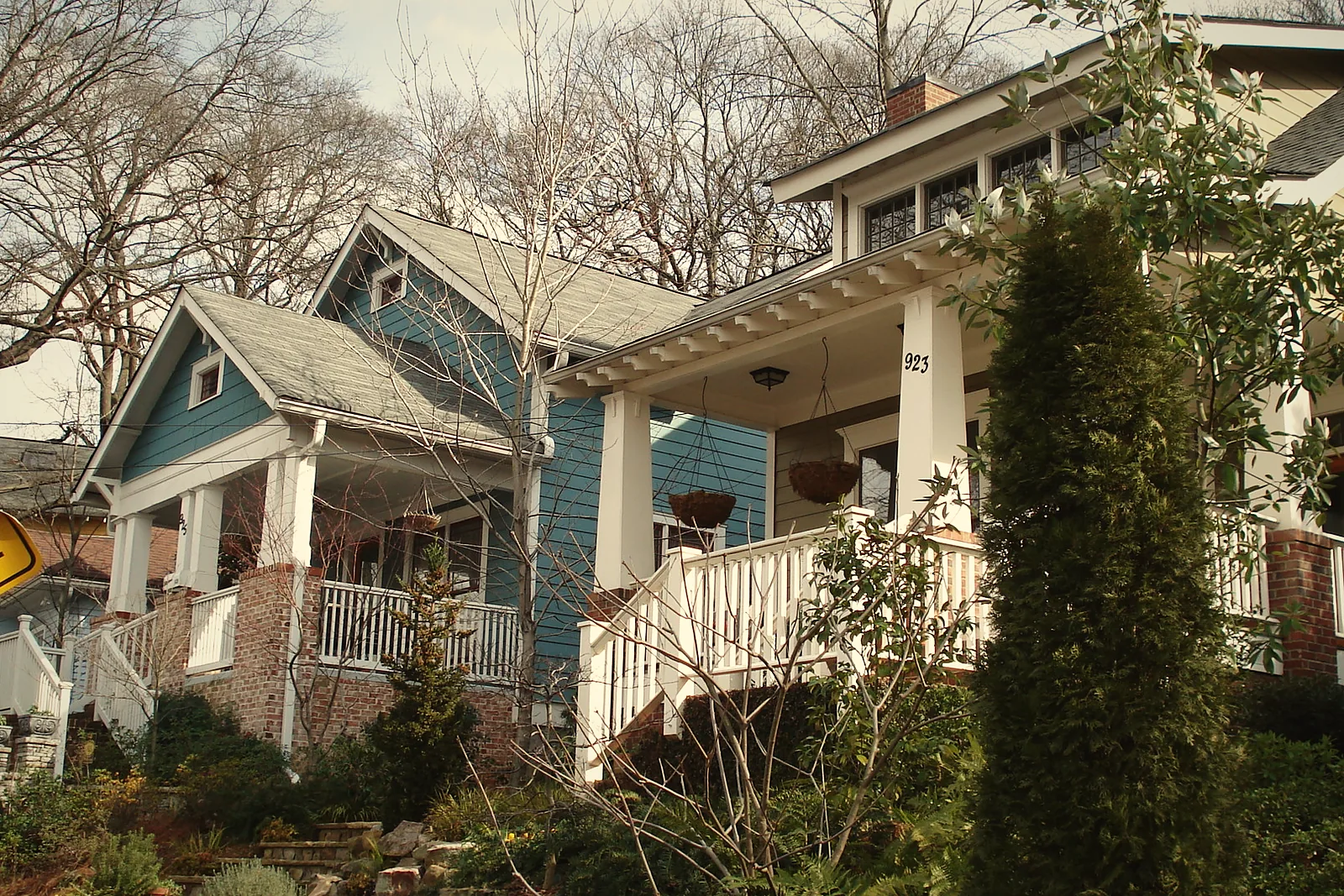 A Craftsman bungalow with a deep front porch on an Atlanta street