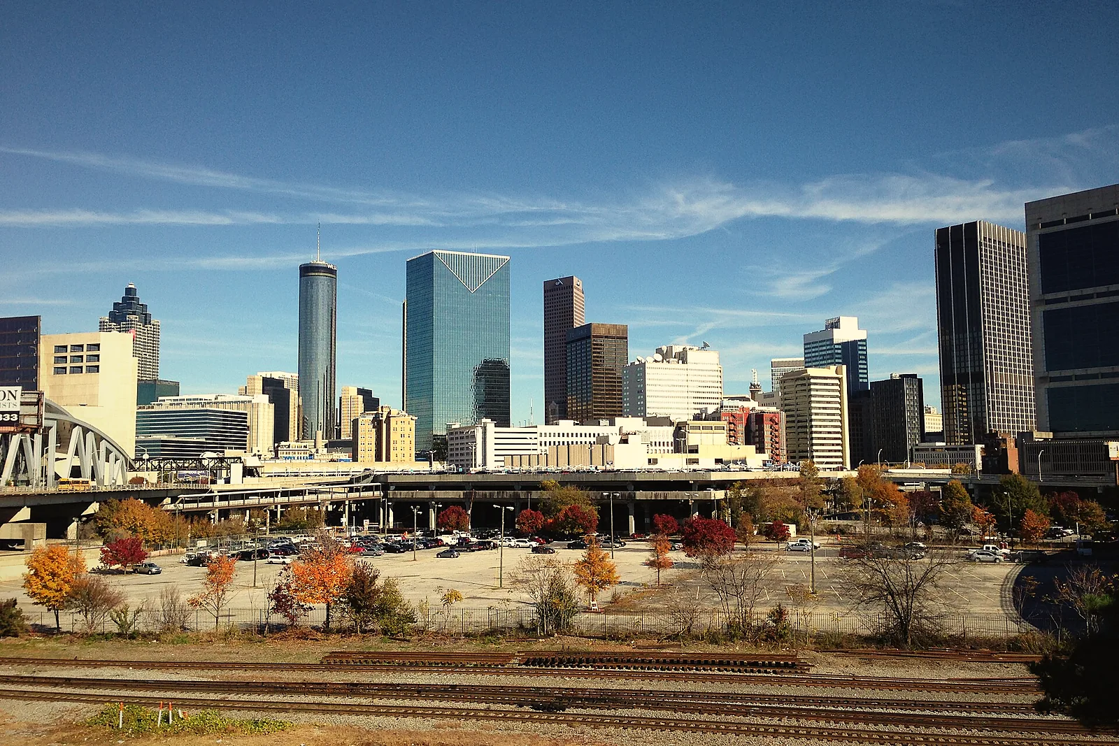 Rail tracks and open land in the Gulch with the downtown skyline behind