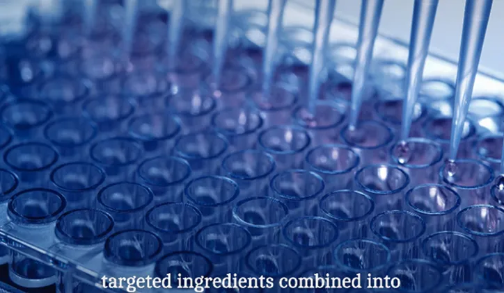 Close-up of multiple pipettes dispensing liquid into wells of a clear plastic laboratory plate under blue lighting.