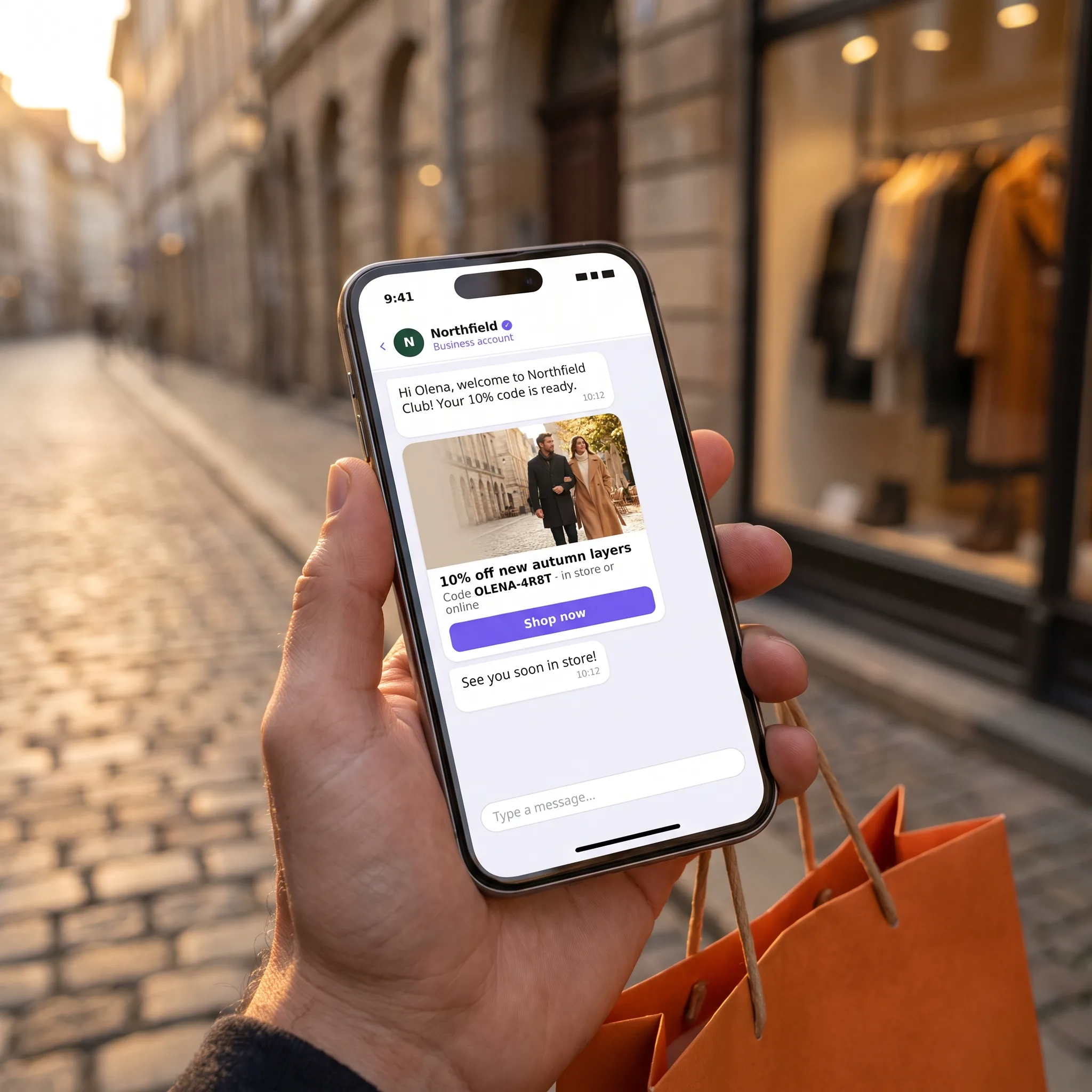 Phone showing a store discount code sent on Viber, with a verified sign-up and a redeemed code