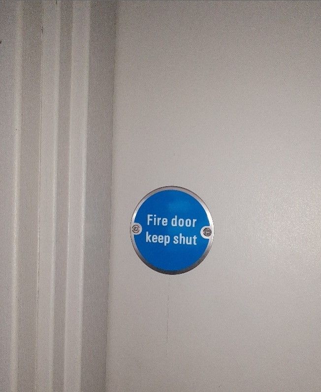Fire door signage reinstated