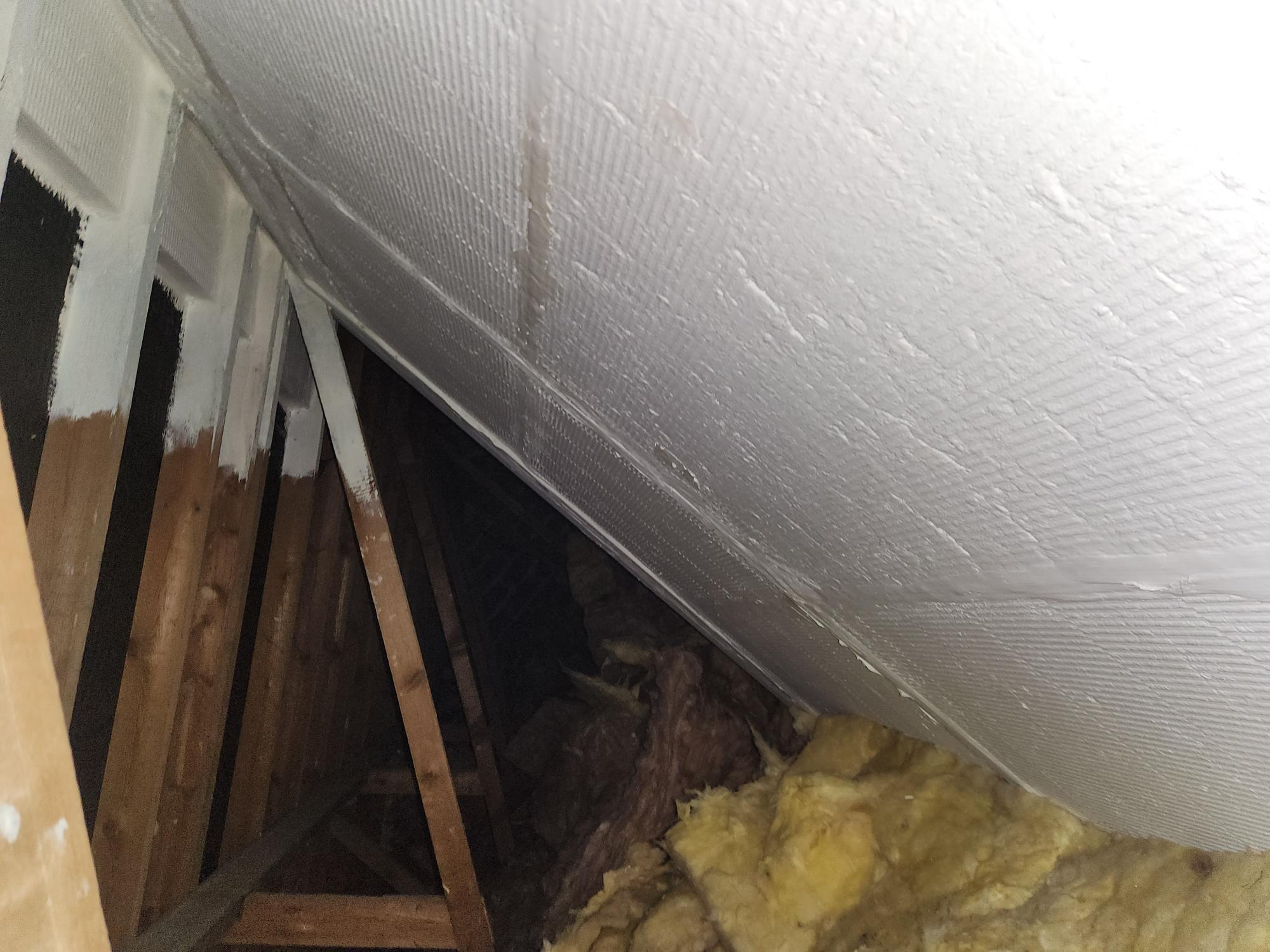 Fire-resistant boarding installed in a loft to create a compartment fire barrier