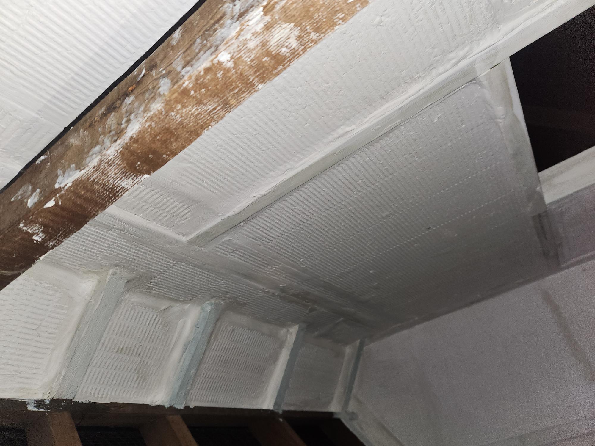 Passive fire protection boards fixed between loft rafters as part of a compartmentation remedial works