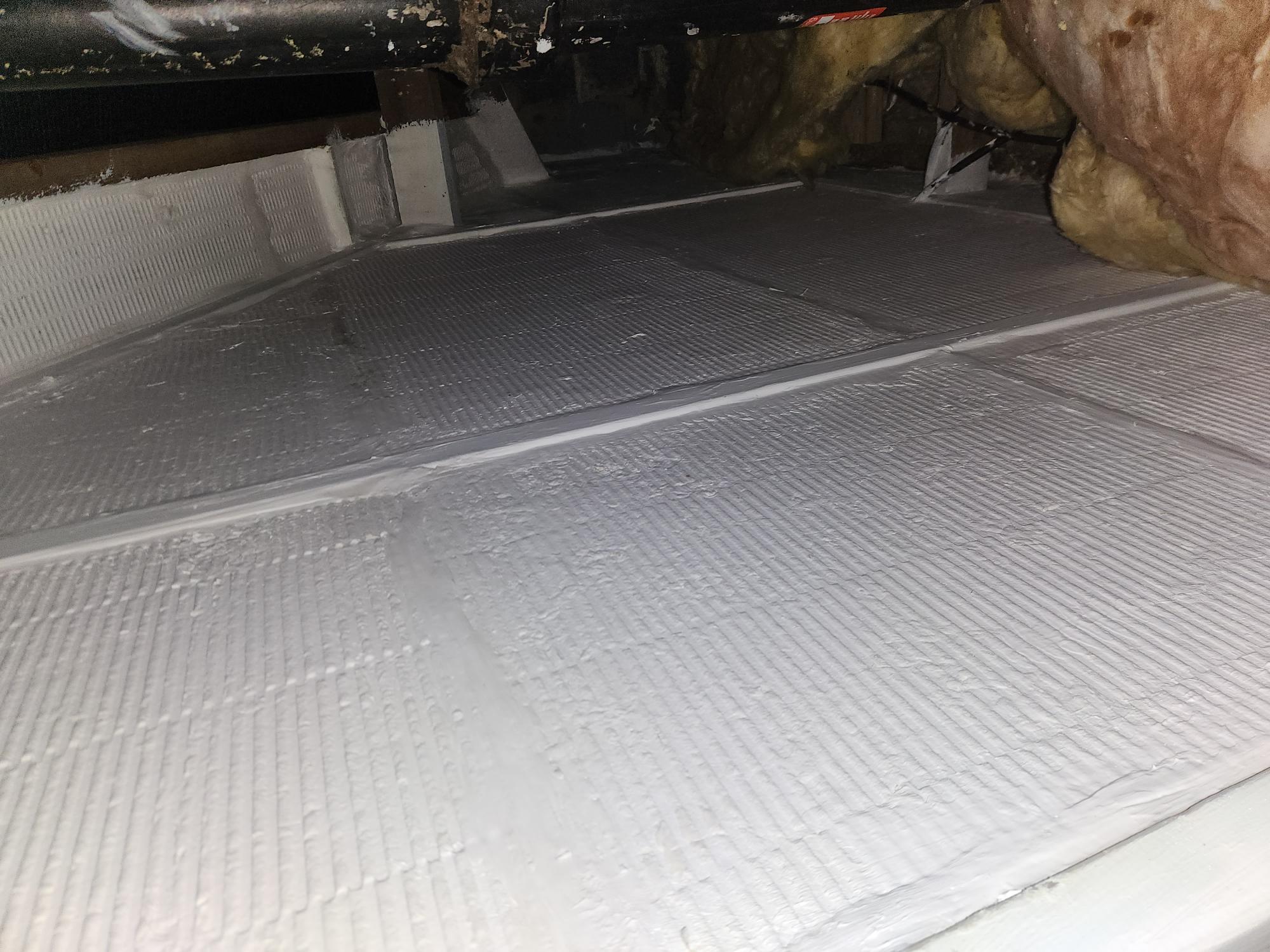Fire-rated boards fitted across a loft roof void for passive fire compartmentation