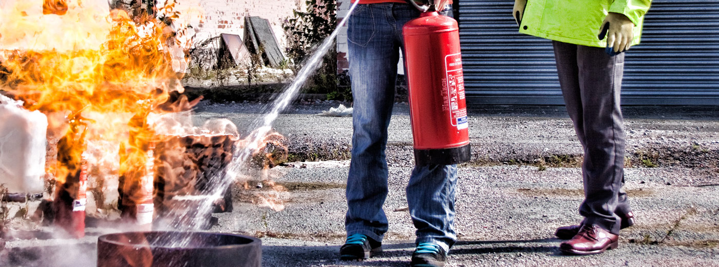 Fire extinguisher training demonstration being carried out on a live fire